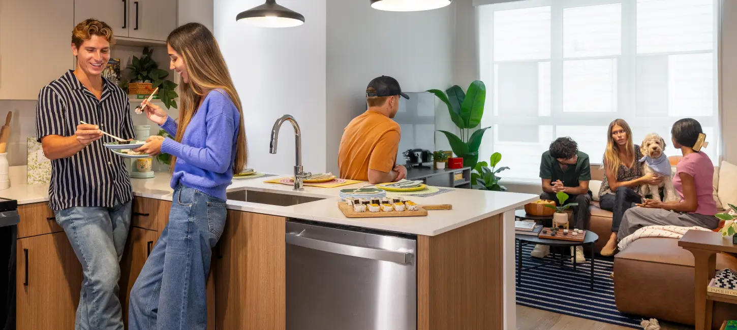 Group of people gathered in apartment.